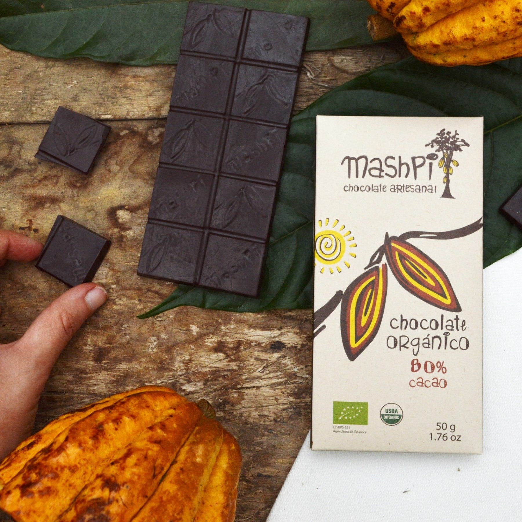 Mashpi Artesenal Chocolate Single Origin-Made in Ecuador. 80% Cacao content. USDA Organic Certified. Chocolate bar and cacao pods.